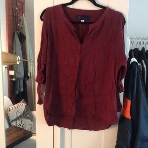 Francesca’s red blouse